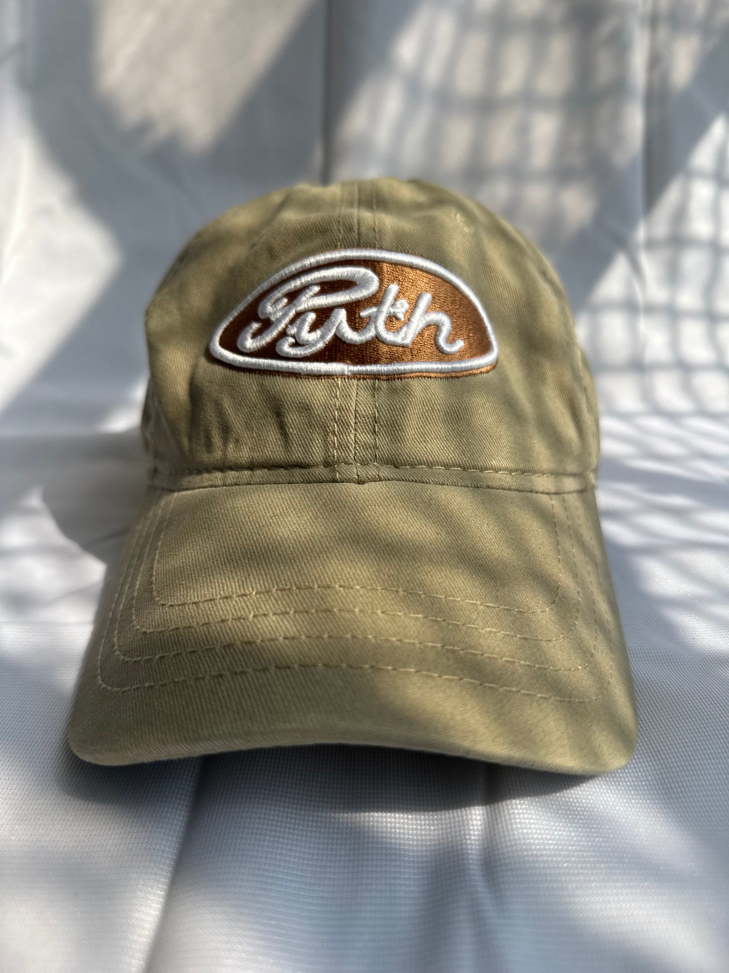 Brown “Pyth” logo cap