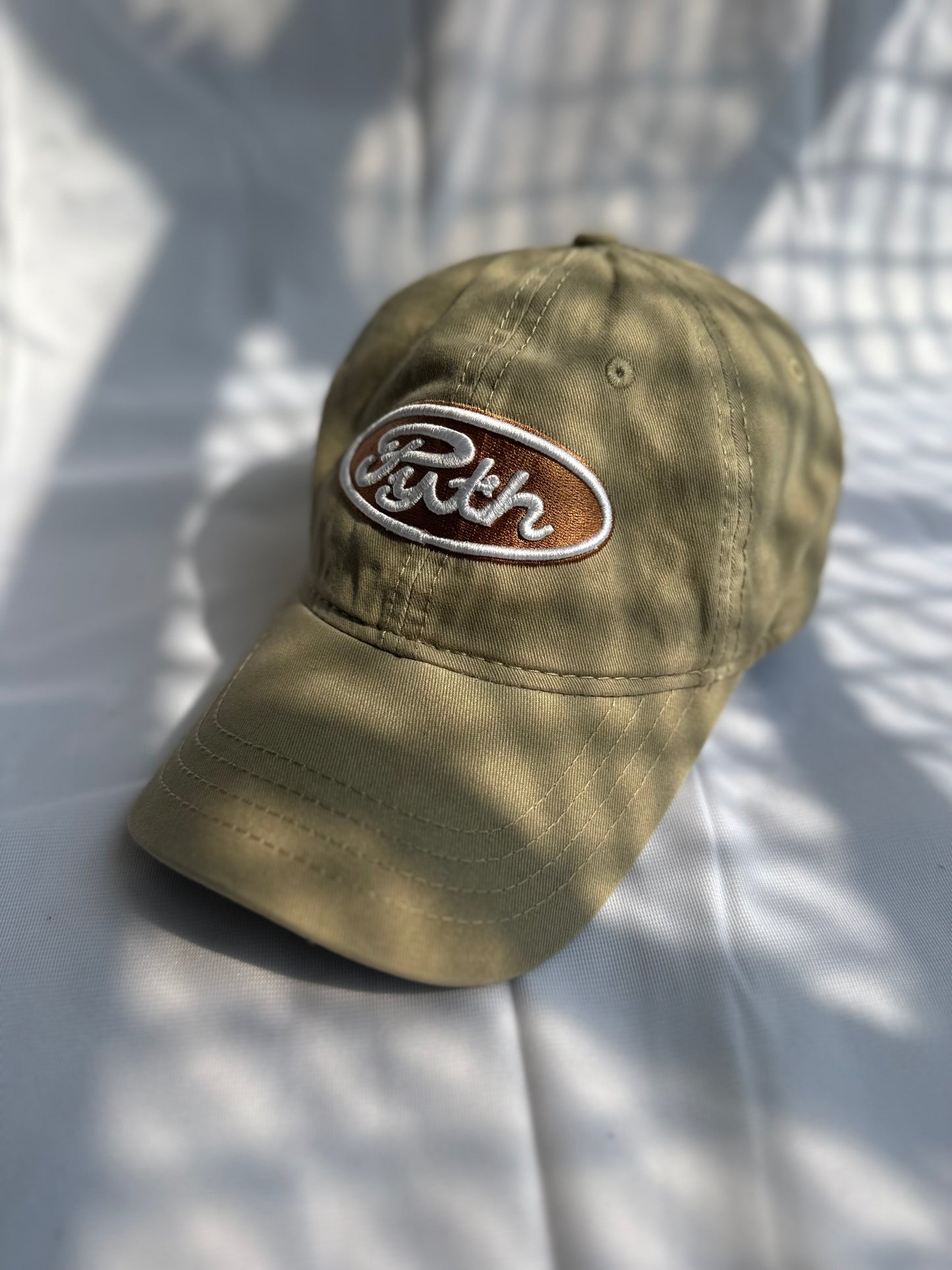 Brown “Pyth” logo cap